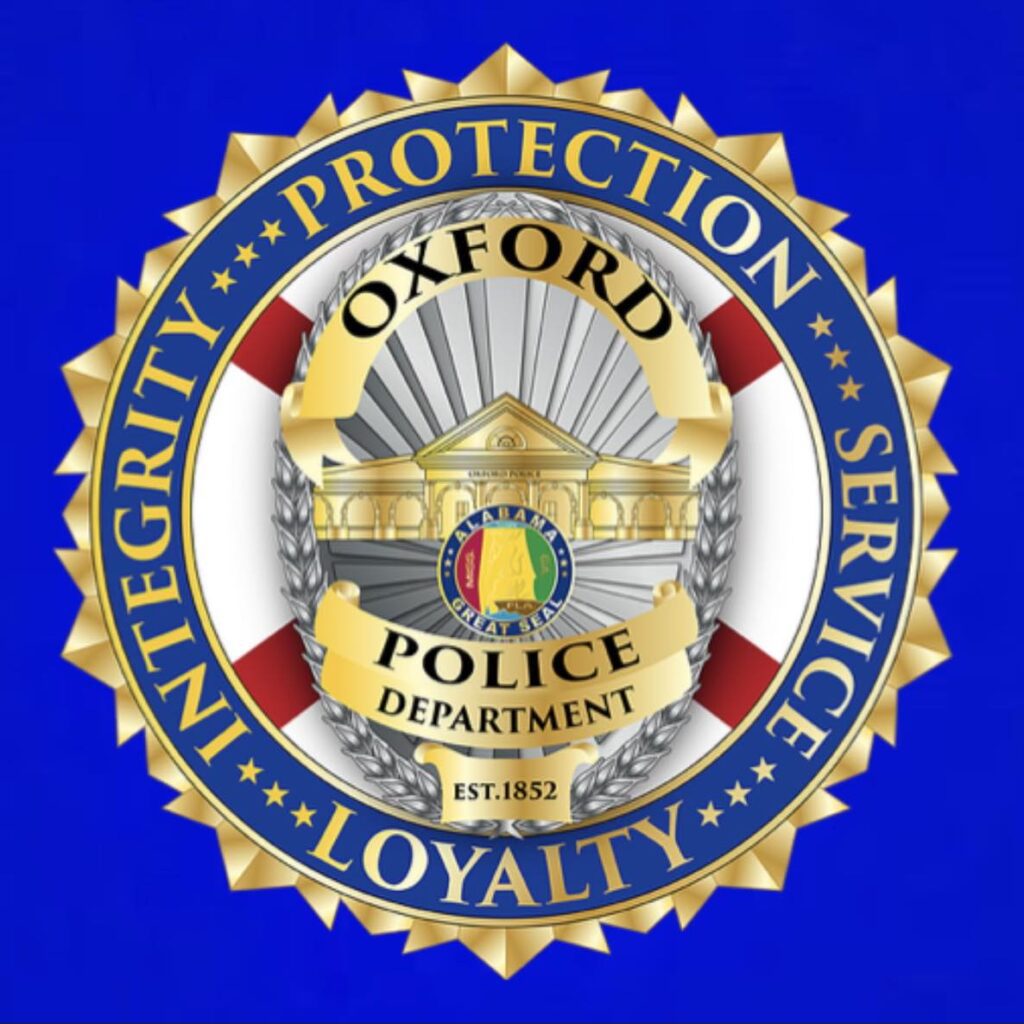 Oxford Police Department logo featuring a shield with crossed batons and the letters "OPD."